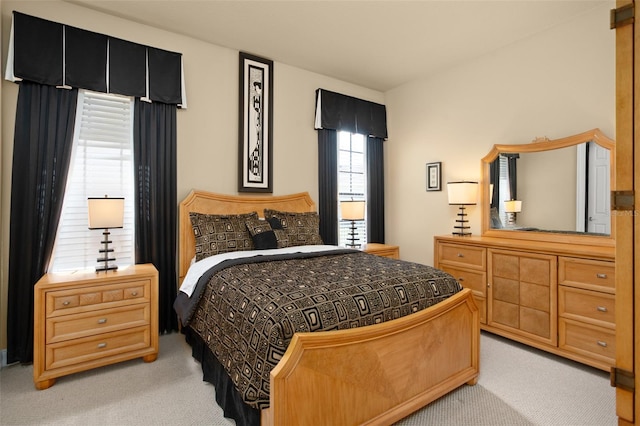 bedroom with light colored carpet