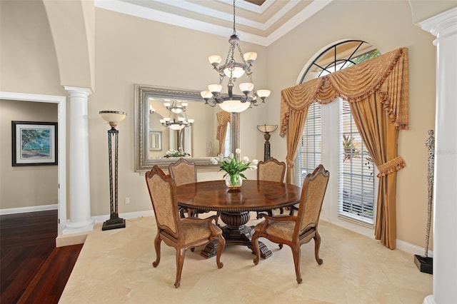 6443 Cartmel Ln, Windermere, FL 34786 - dining room featuring ornate columns, a towering ceiling, an inviting chandelier, ornamental molding, and baseboards
