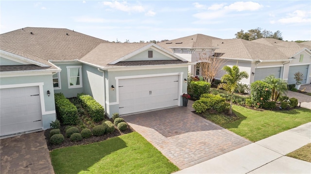 ranch-style home with a front yard and a garage