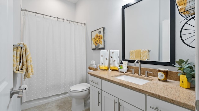 bathroom with oversized vanity, toilet, and tile flooring