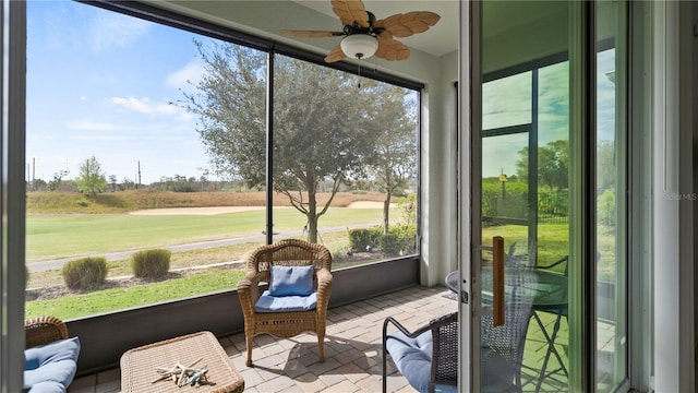 sunroom / solarium with ceiling fan