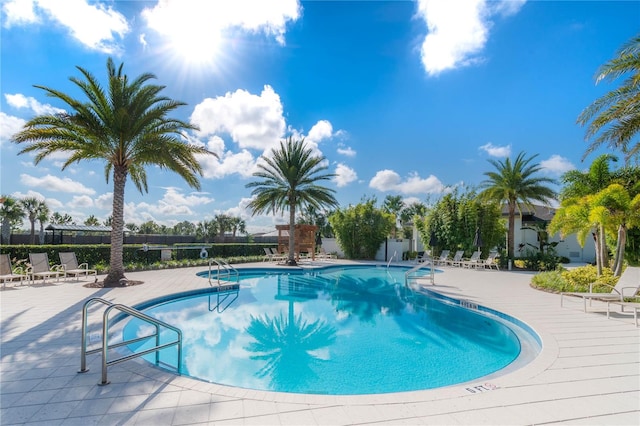 view of swimming pool featuring a patio area