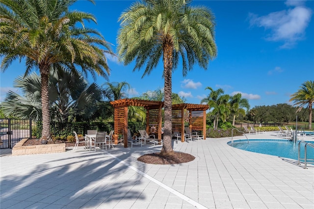 view of pool featuring a pergola and a patio area