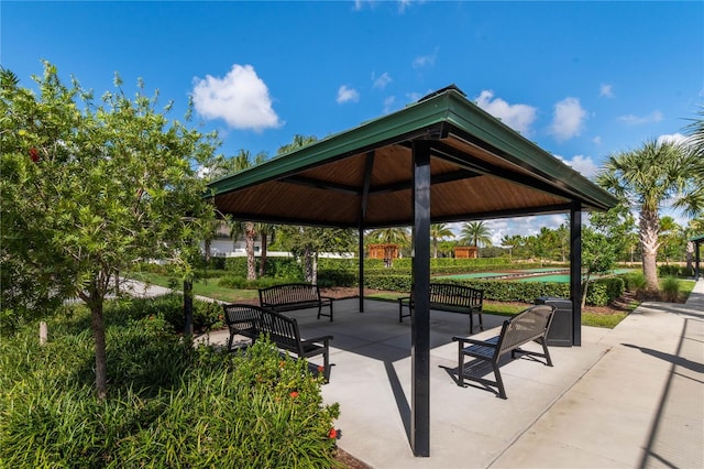 surrounding community with a patio and a gazebo