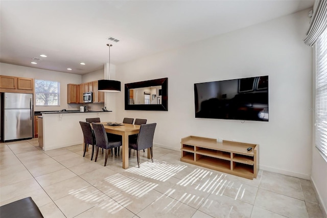 dining room featuring light tile floors