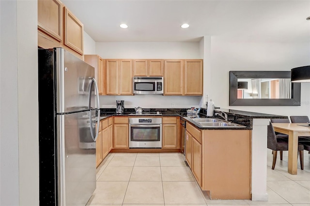 kitchen featuring sink, appliances with stainless steel finishes, kitchen peninsula, and light tile flooring