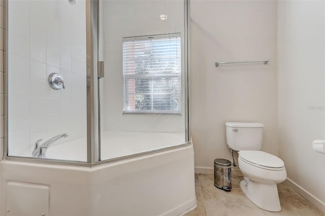 bathroom featuring toilet and tile flooring