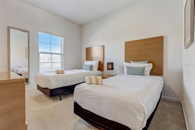 bedroom with light colored carpet