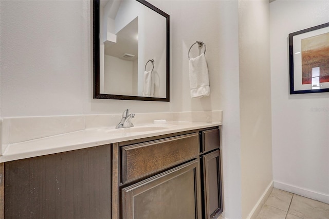 bathroom with tile flooring and vanity