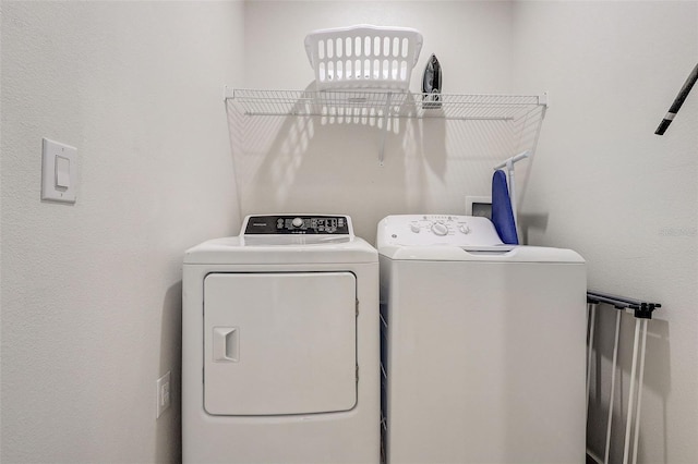 laundry room featuring washer and clothes dryer