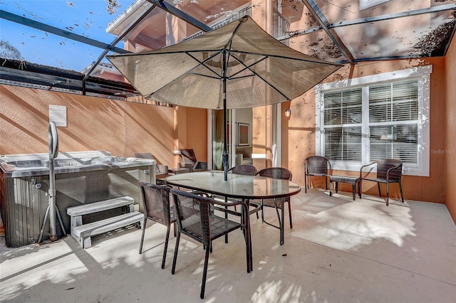 view of patio / terrace with a hot tub