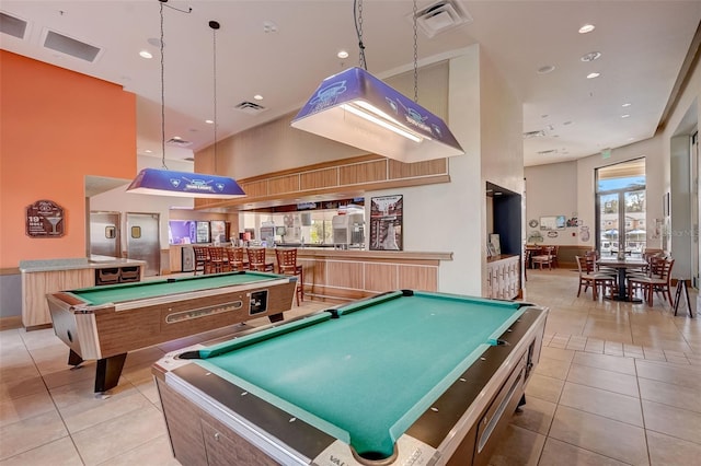 playroom featuring billiards, light tile floors, and a high ceiling