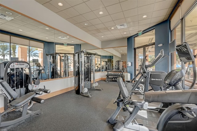 gym featuring a drop ceiling