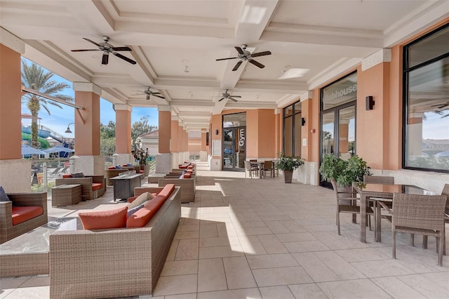 view of patio with an outdoor living space and ceiling fan