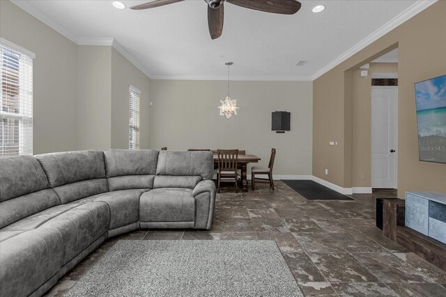 tiled living room featuring crown molding and ceiling fan with notable chandelier