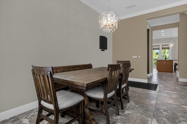 tiled dining area featuring crown molding, an inviting chandelier, and sink