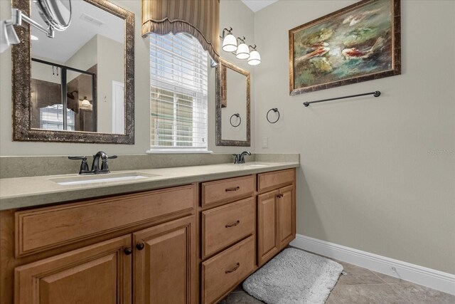 bathroom with dual vanity and tile floors