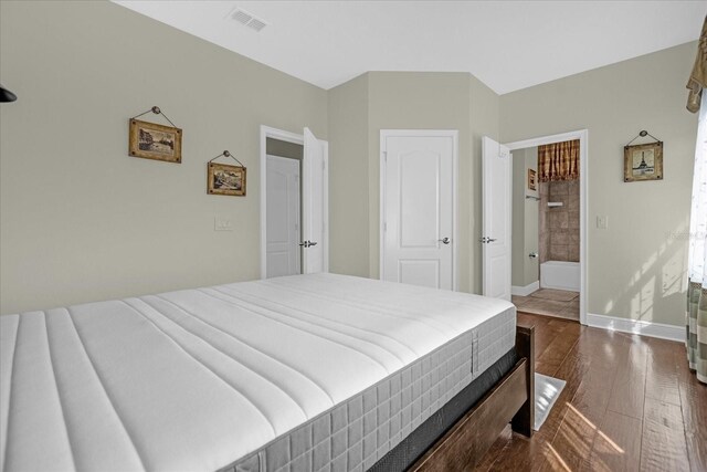 bedroom featuring dark hardwood / wood-style floors