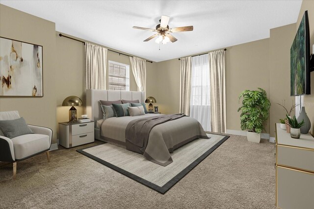 bedroom featuring light colored carpet and ceiling fan