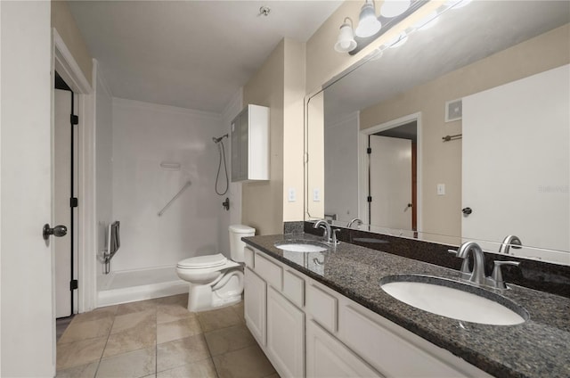 bathroom with tile patterned floors, a shower, dual vanity, and toilet