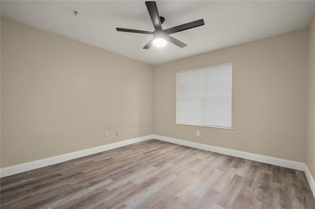 empty room featuring ceiling fan and wood-type flooring