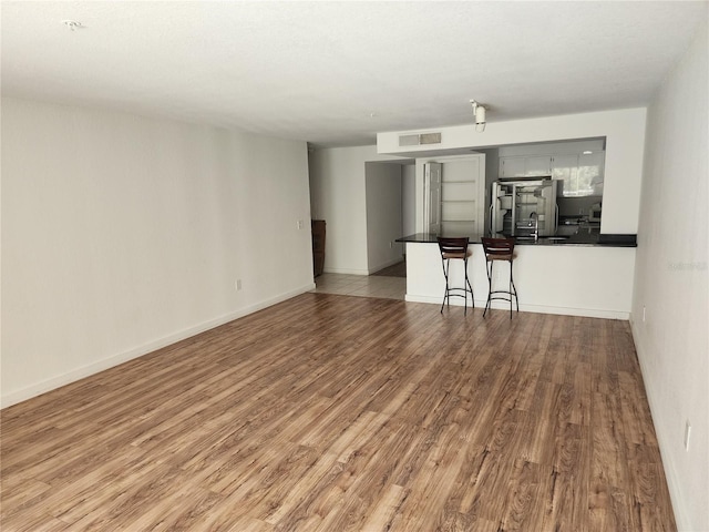 spare room featuring hardwood / wood-style flooring