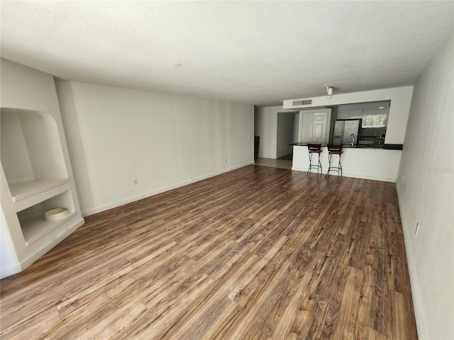 unfurnished room featuring hardwood / wood-style flooring