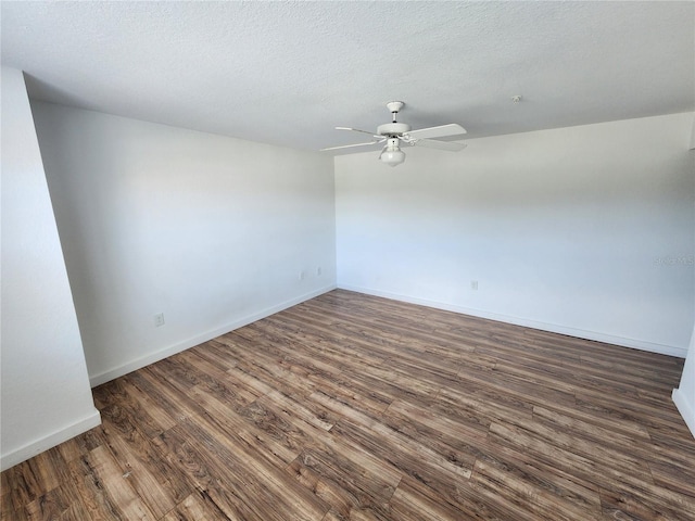 unfurnished room with dark hardwood / wood-style flooring, a textured ceiling, and ceiling fan