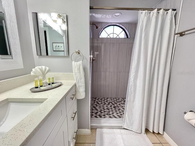 bathroom with vanity, tile flooring, and curtained shower