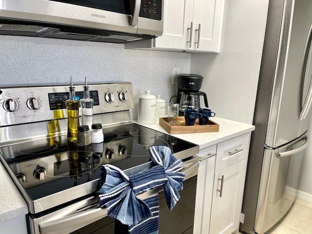 kitchen with white cabinets and stainless steel appliances