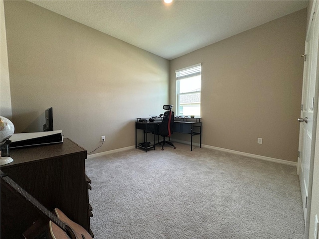 carpeted office space with lofted ceiling