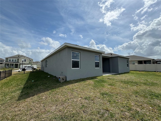 view of side of property featuring a yard