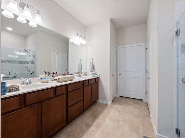 bathroom with an enclosed shower, tile flooring, double sink, and vanity with extensive cabinet space