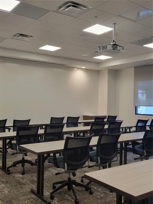 office space with carpet and a paneled ceiling