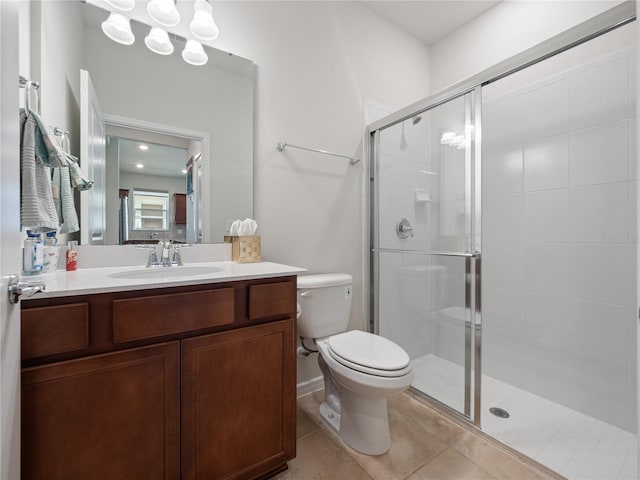 bathroom with tile floors, an enclosed shower, large vanity, and toilet