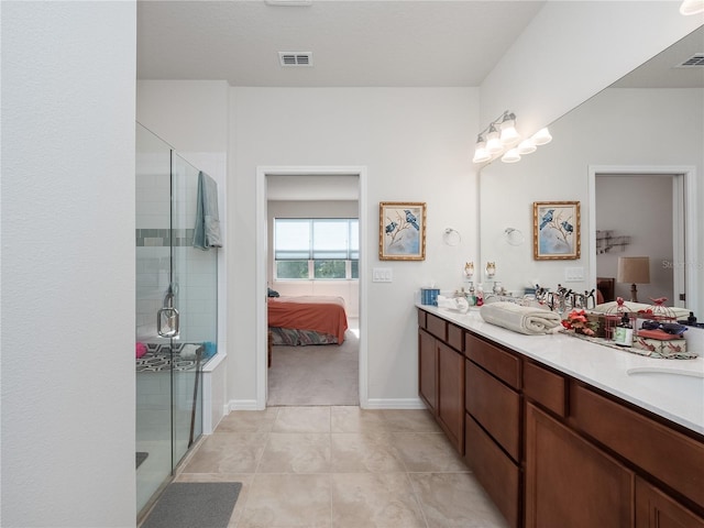 bathroom with walk in shower, tile flooring, and double sink vanity