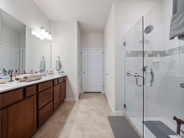 bathroom featuring walk in shower, tile flooring, and double vanity