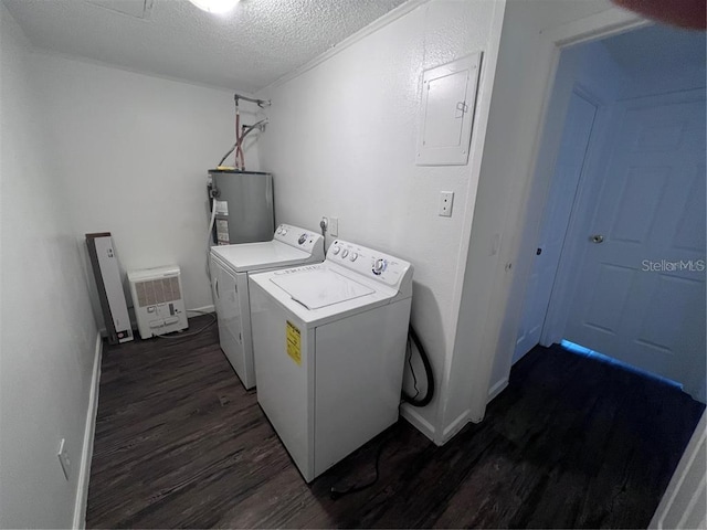 washroom with dark hardwood / wood-style floors, a textured ceiling, electric water heater, and washer and dryer