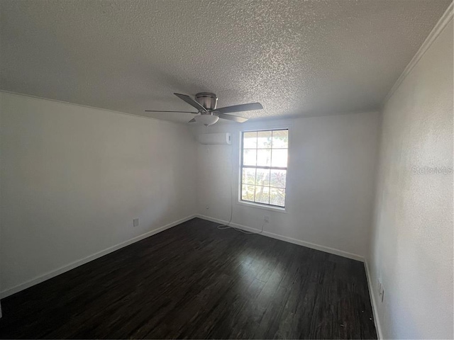 empty room with a textured ceiling, ceiling fan, and dark hardwood / wood-style flooring