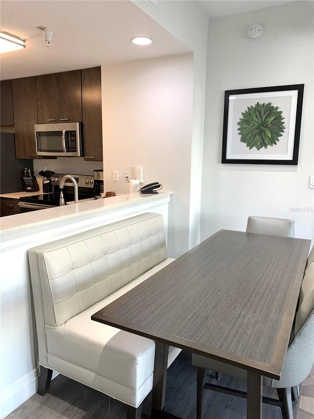 dining area featuring hardwood / wood-style flooring