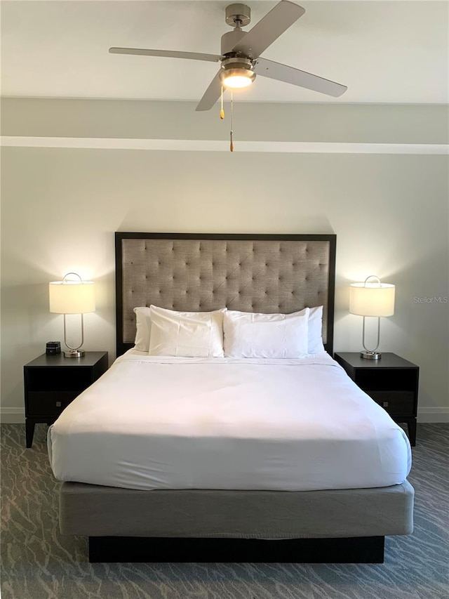 bedroom with dark carpet and ceiling fan