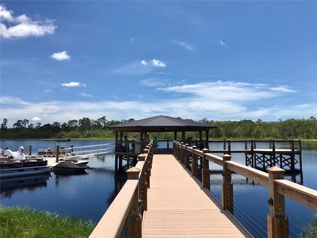 dock area with a gazebo and a water view