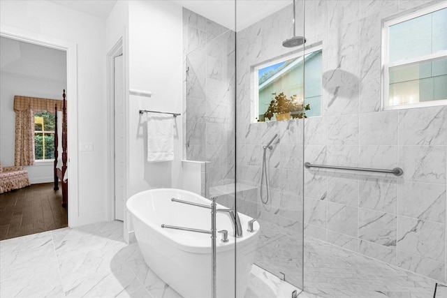 bathroom with shower with separate bathtub