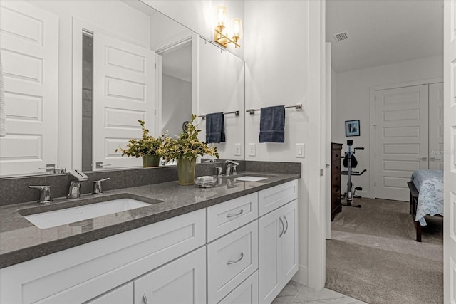 bathroom featuring vanity and an inviting chandelier