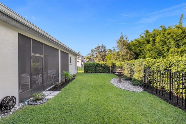 view of yard with a sunroom