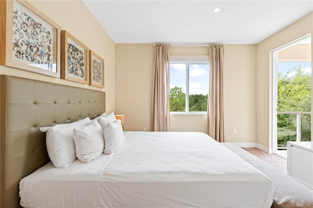 bedroom featuring light carpet