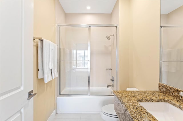 full bathroom featuring enclosed tub / shower combo, toilet, tile flooring, and vanity