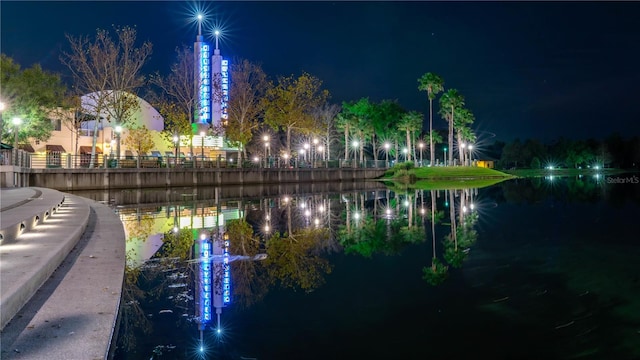 surrounding community with a water view