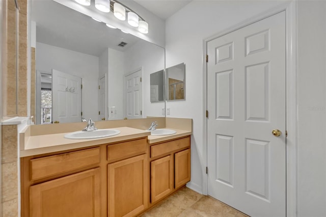 bathroom featuring tile patterned floors and vanity