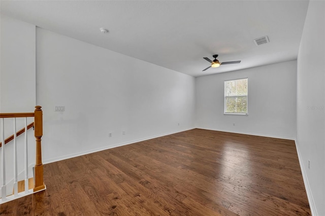 spare room with ceiling fan and wood-type flooring